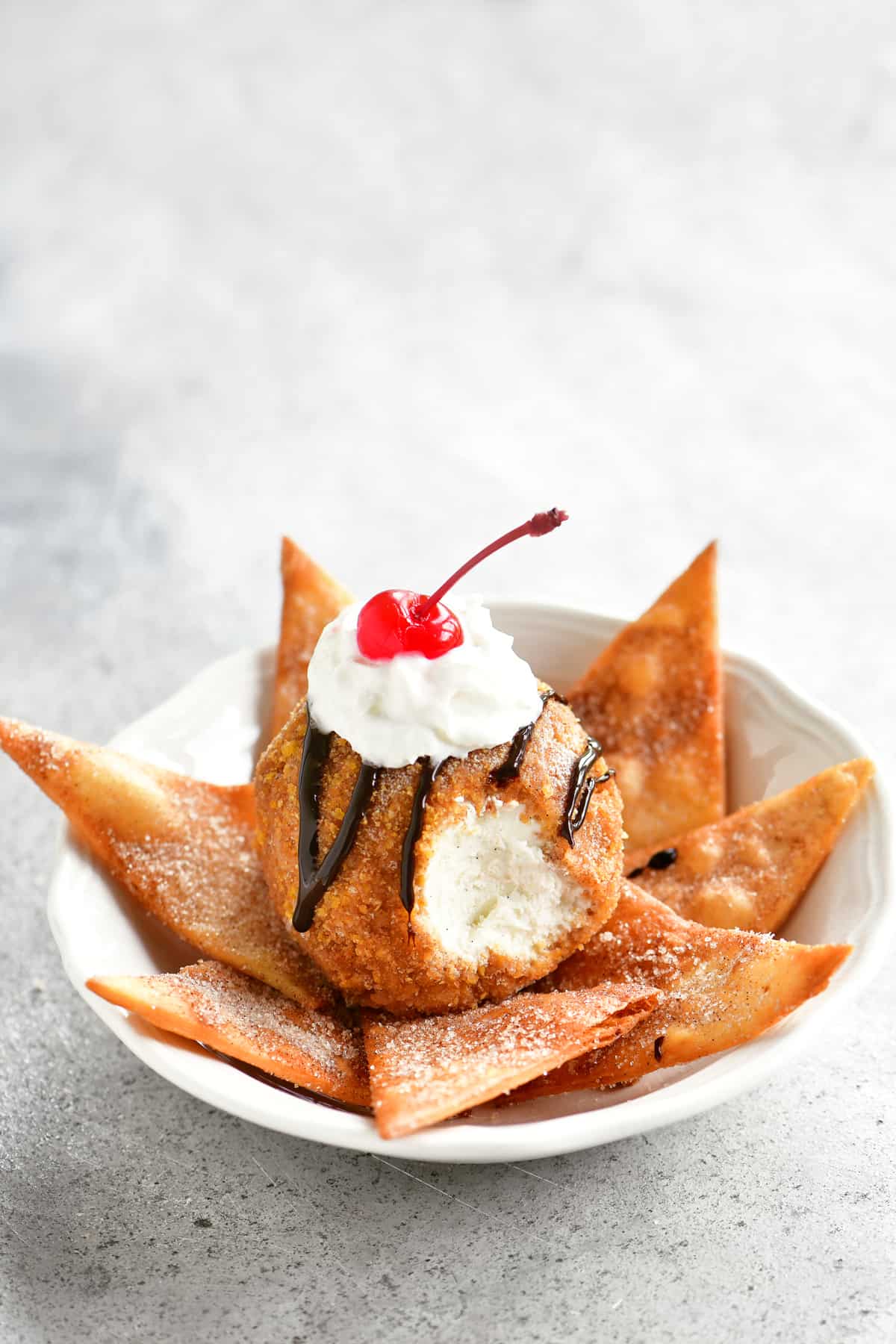 fried ice cream dessert with a bite out of it