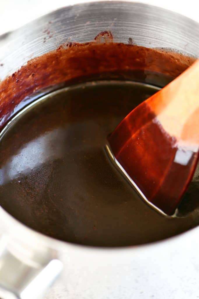 stirring in vanilla with a wooden spoon