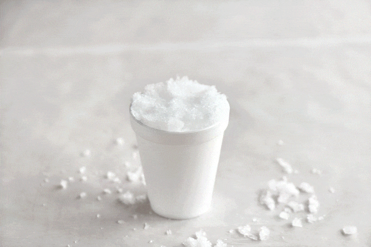 photos of putting fluffy snow in a cup with colorful syrup