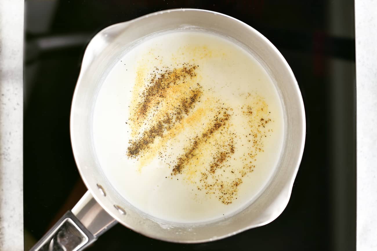 adding spices to the milk and butter