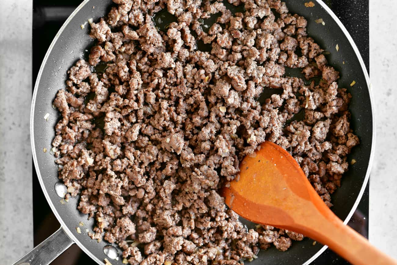 browned ground beef in a skillet.