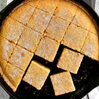 a topdown shot of sliced cornbread in the pan