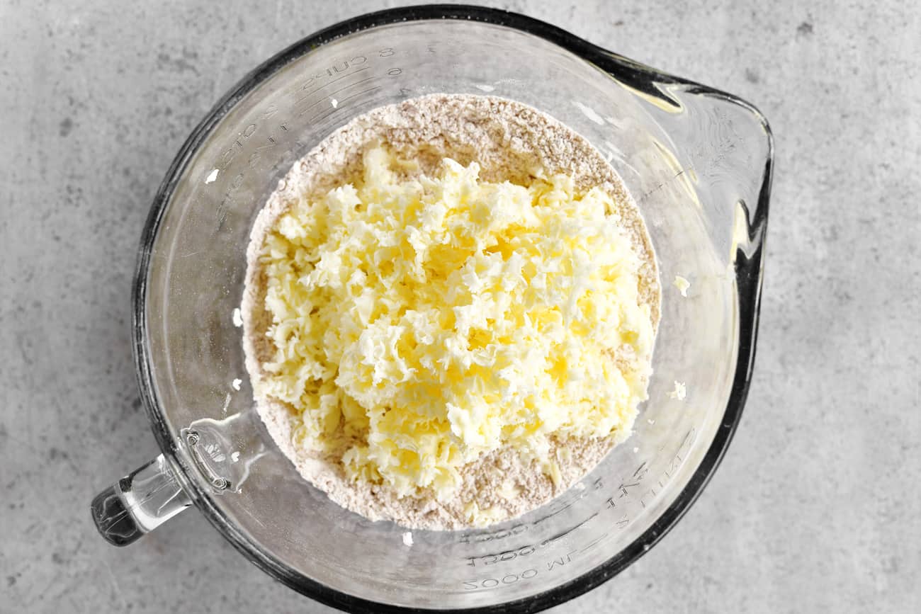 adding grated butter to dry ingredients