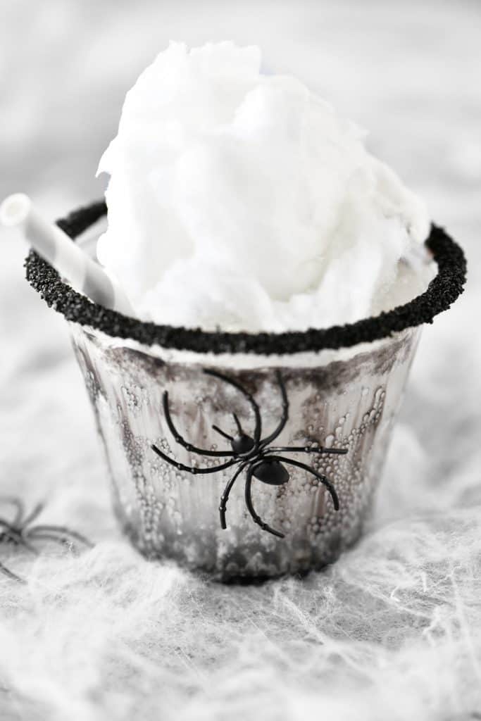 Black spider drink with cotton candy on top.