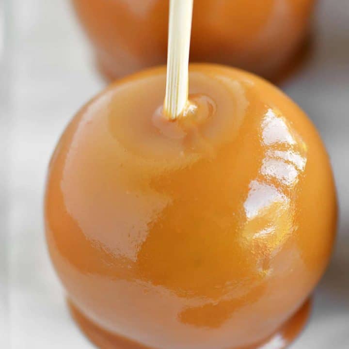 a close-up photo of 2 caramel apples