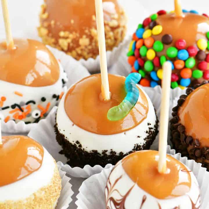 a close-up of candy coated caramel apples