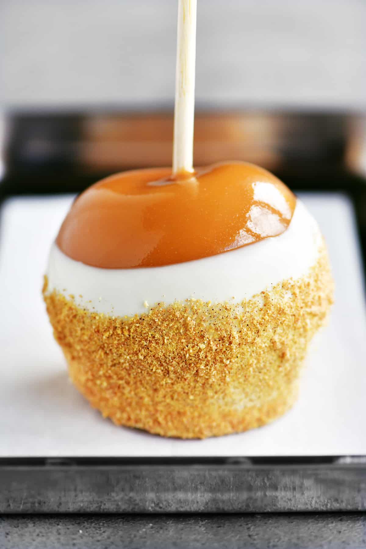 a photo of a cheesecake inspired caramel apple