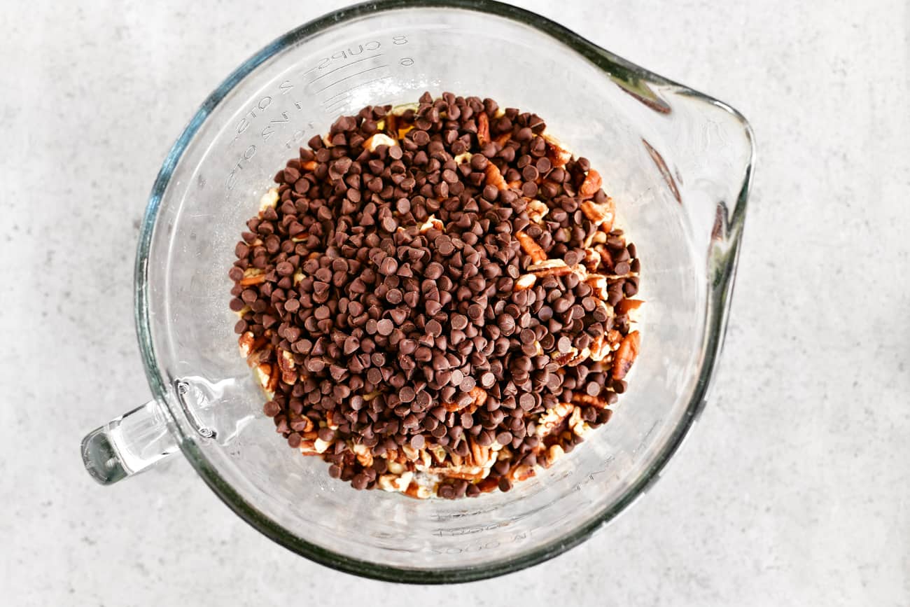 chocolate pecan pie filling ingredients in a mixing bowl