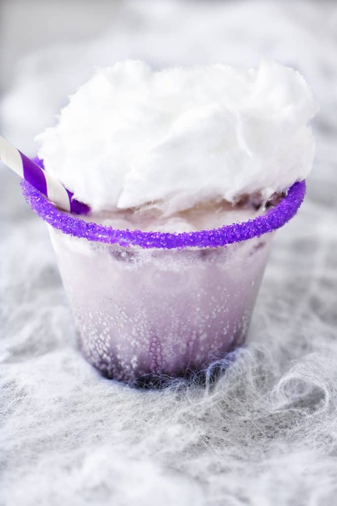 a photo of a purple themed Halloween drink