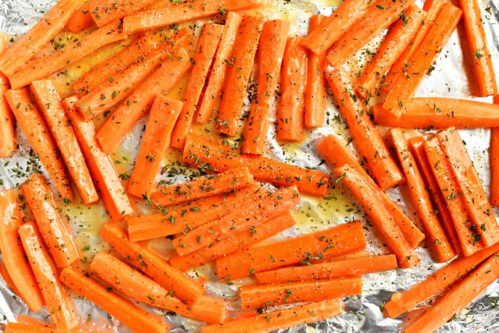 adding the seasoning to the carrots