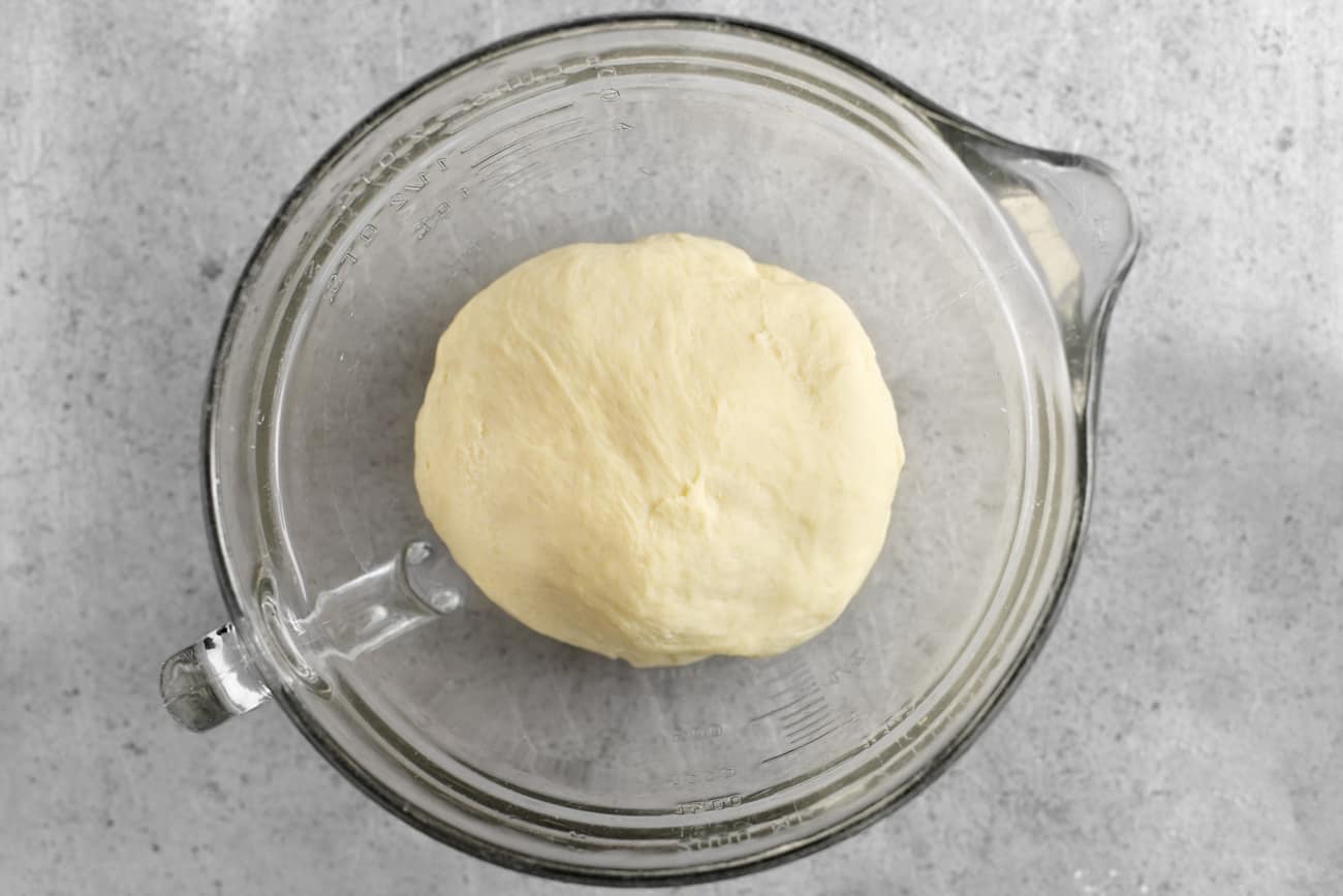 cover the dinner roll dough with plastic