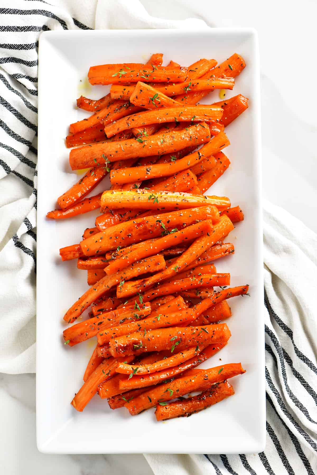 a beautiful topdown photo of the seasoned carrots on a platter
