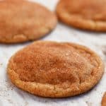 baked snickerdoodles on parchment paper