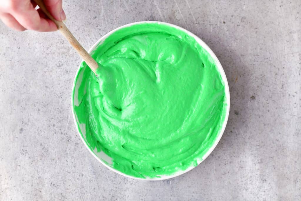adding green dye to the batter