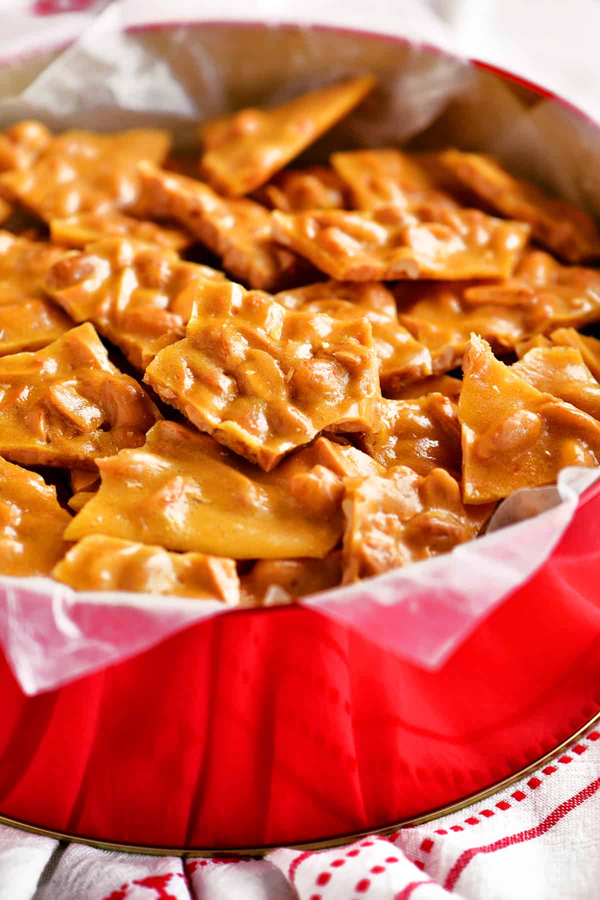delicious peanut brittle in a Christmas container