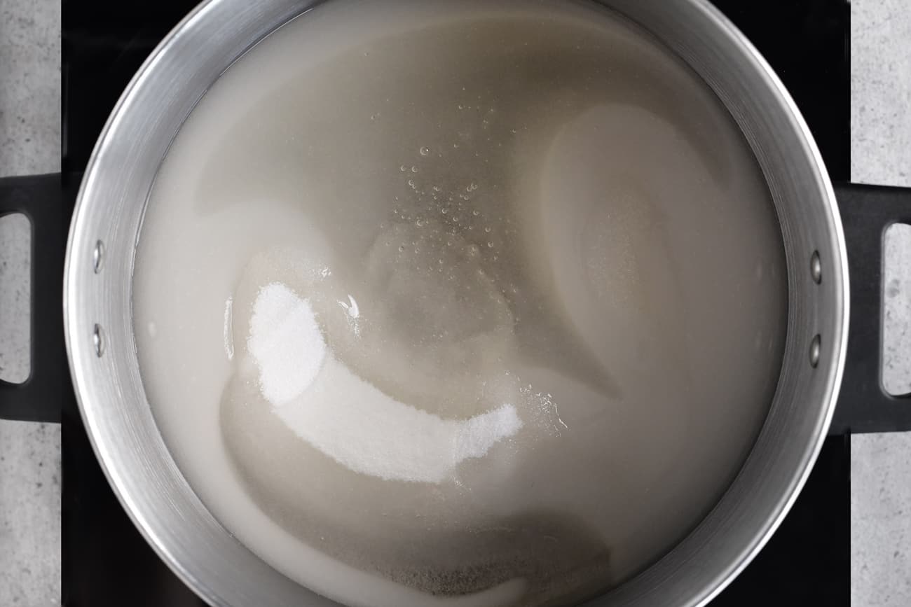 a photo showing the sugar, water and corn syrup in a pot