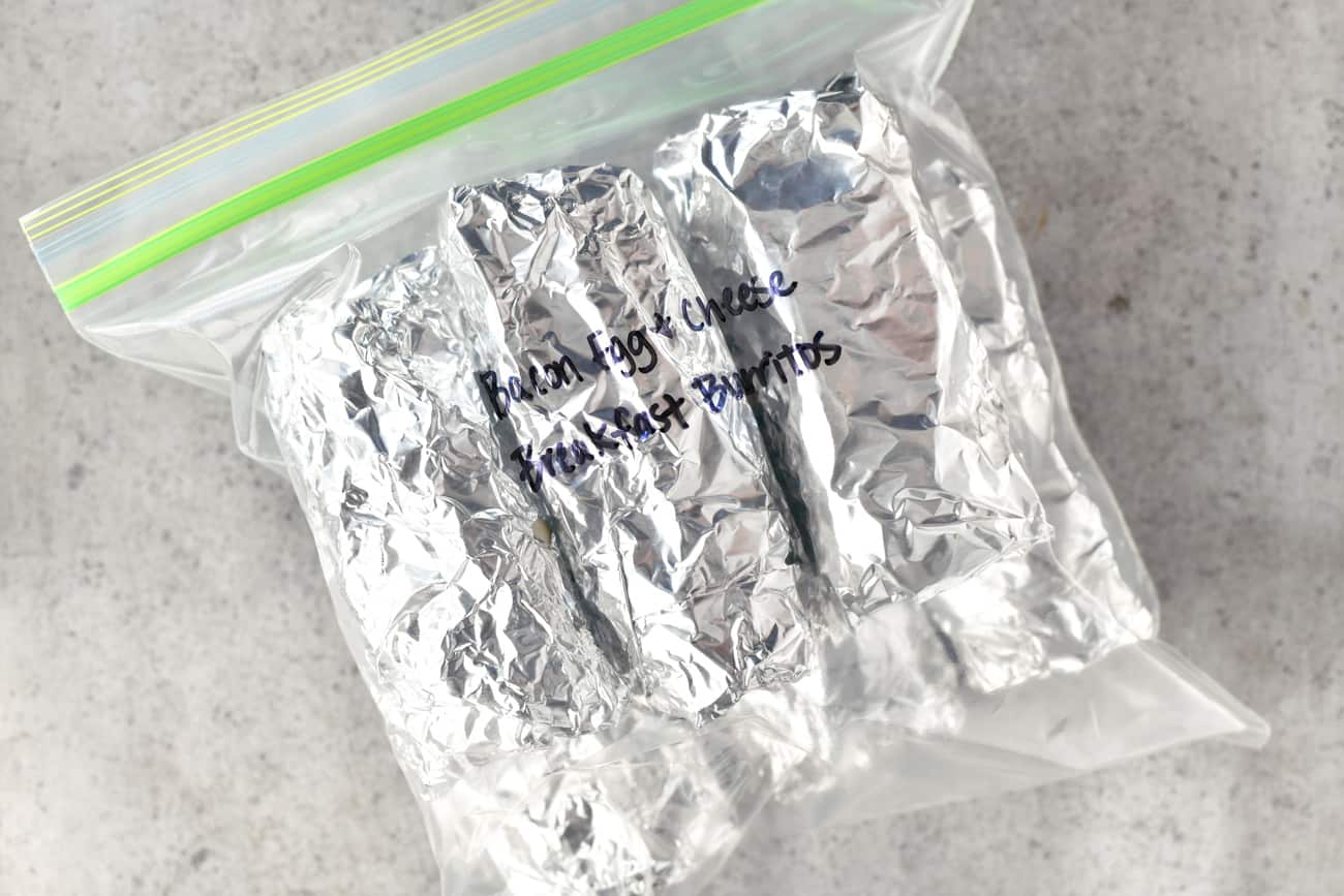 foil wrapped burritos in a labeled gallon size plastic bag