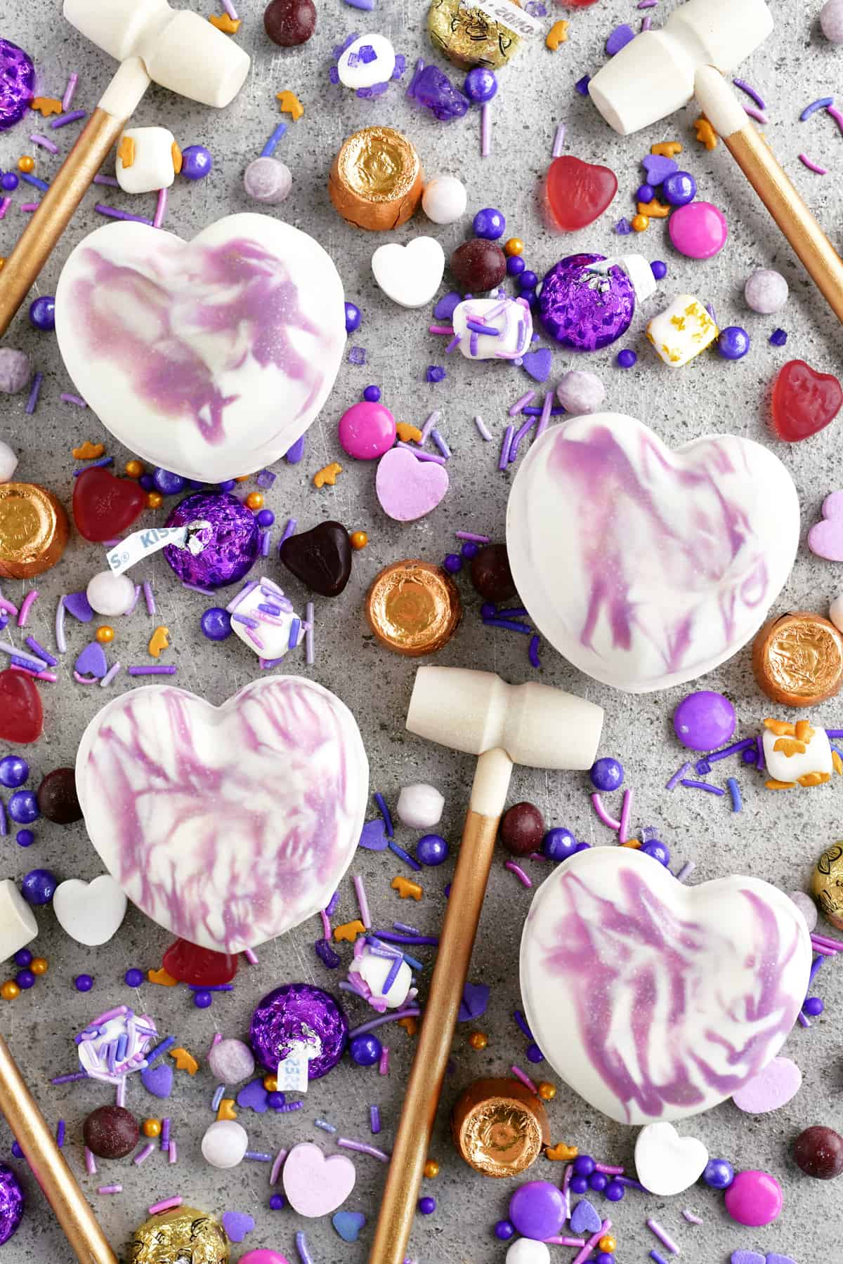 breakable chocolate hearts with candy and mini mallets