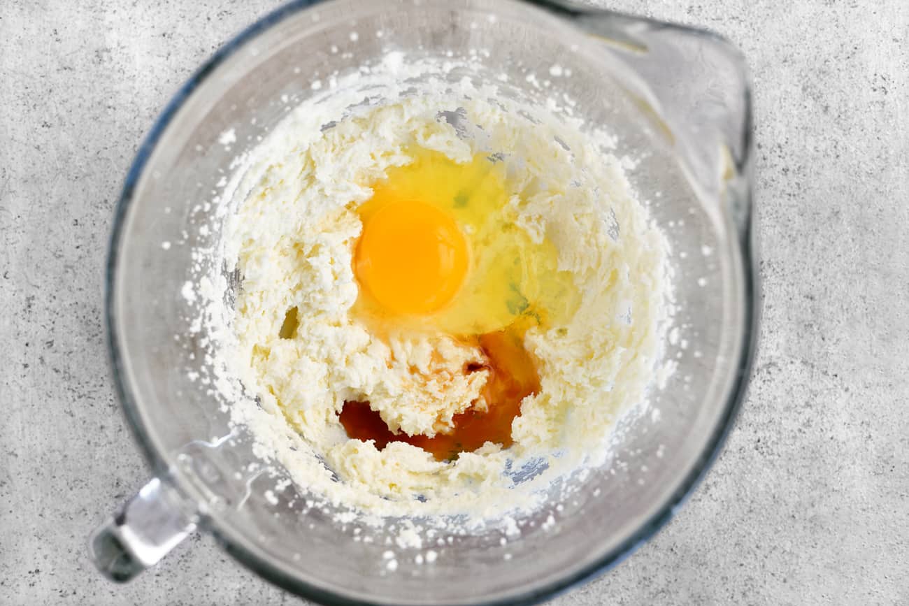 add egg and vanilla to mixing bowl