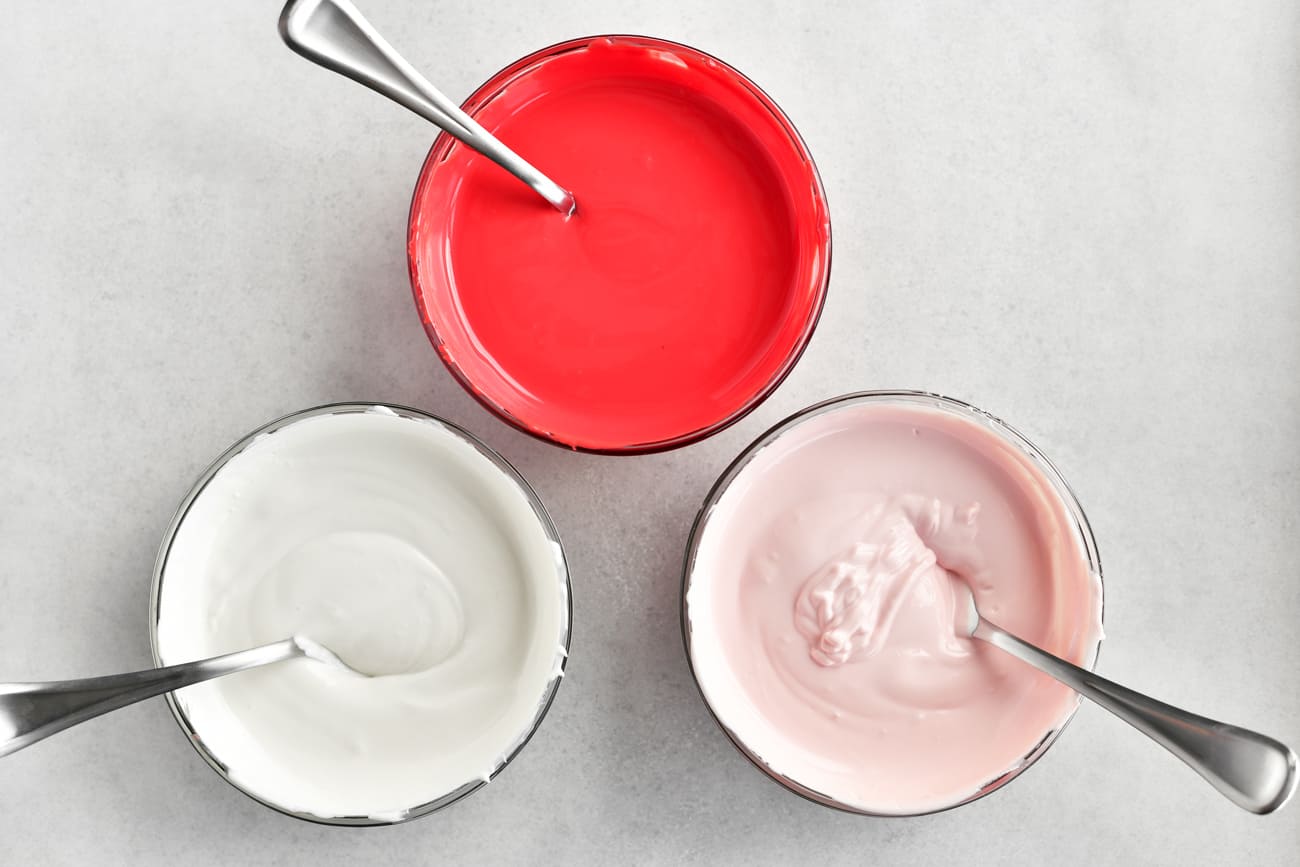 Red, pink, and white melted candy wafers.