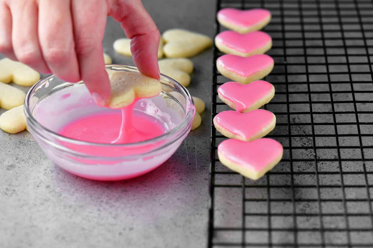 dipping in pink icing