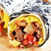 a breakfast burrito wrapped in foil
