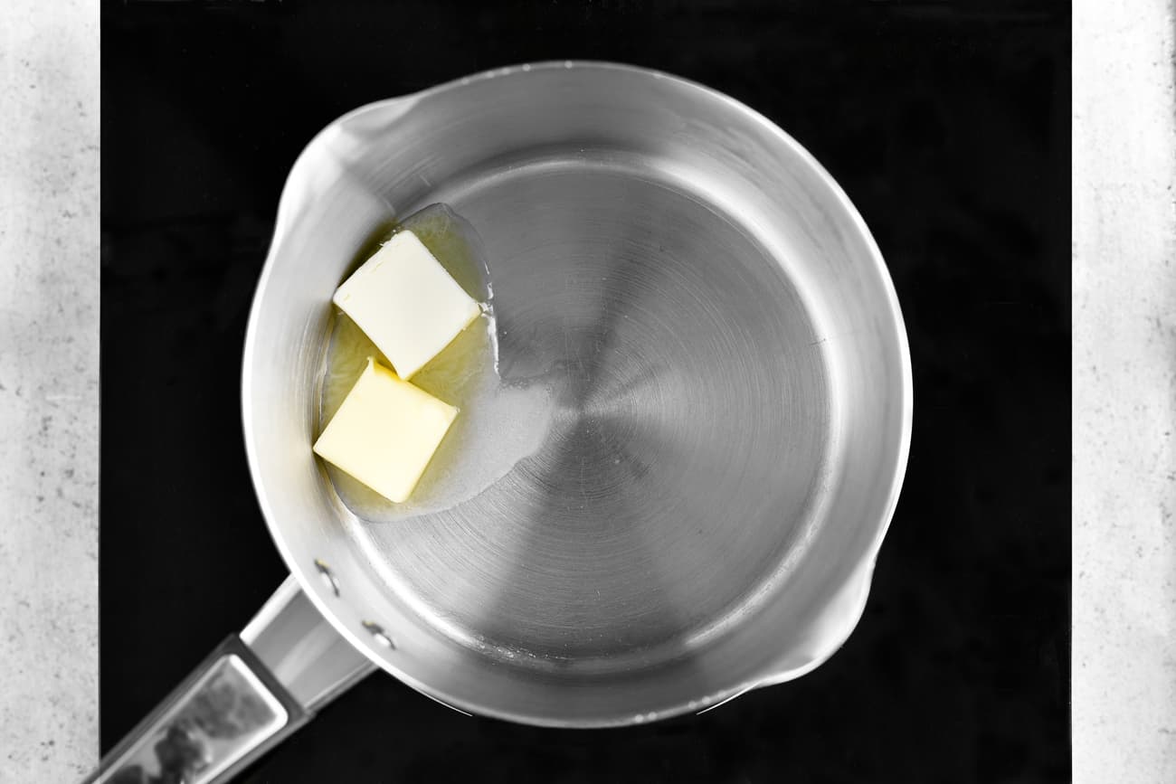 adding butter to the saucepan