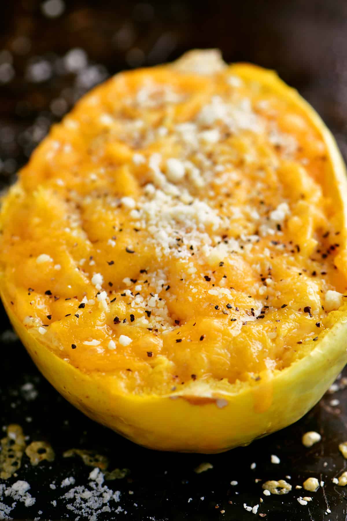 a close-up photo of the baked macaroni and cheese spaghetti squash