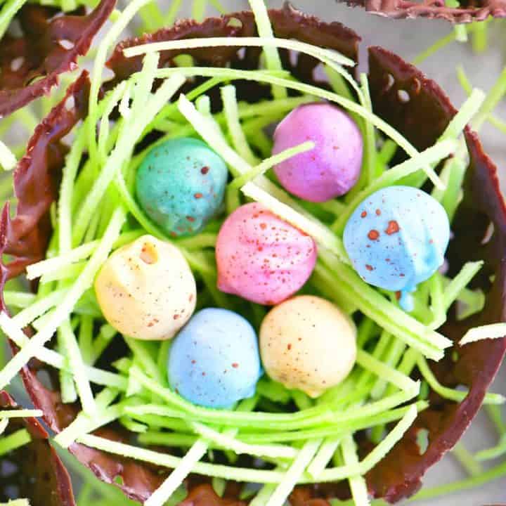 a chocolate nest with grass and eggs inside