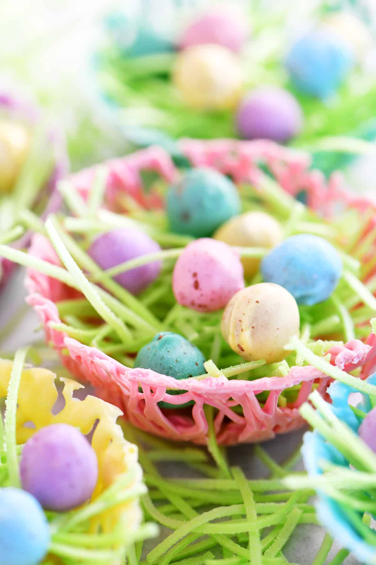 colorful chocolate easter nests with colorful easter egg pretzel nuggets inside