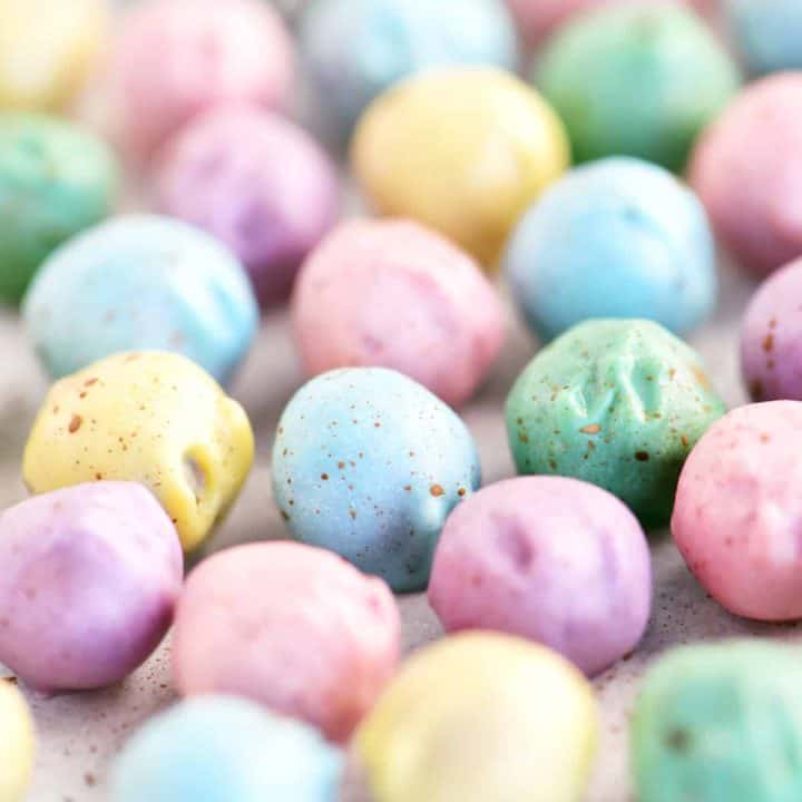 many bright colorful easter egg pretzel nuggets in a bunch