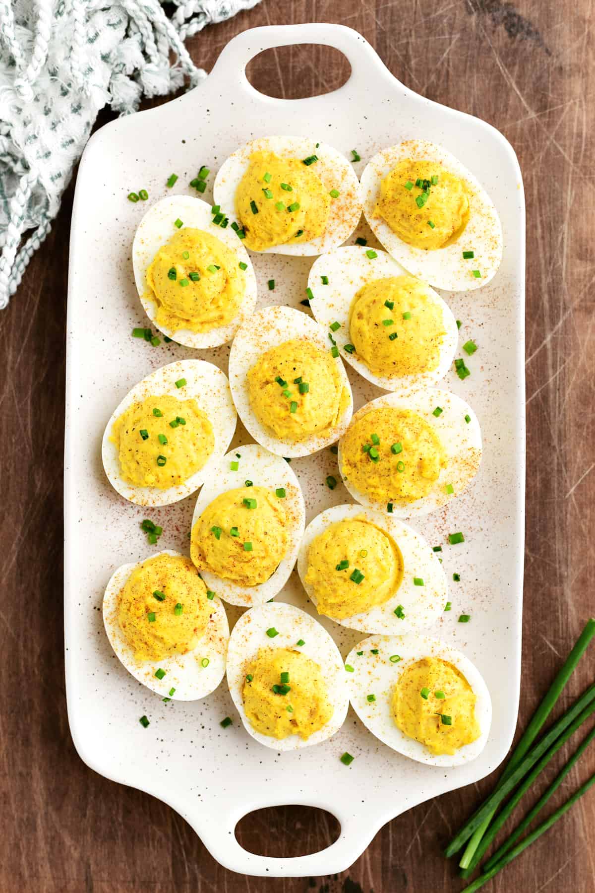 a dozen deviled eggs on a platter