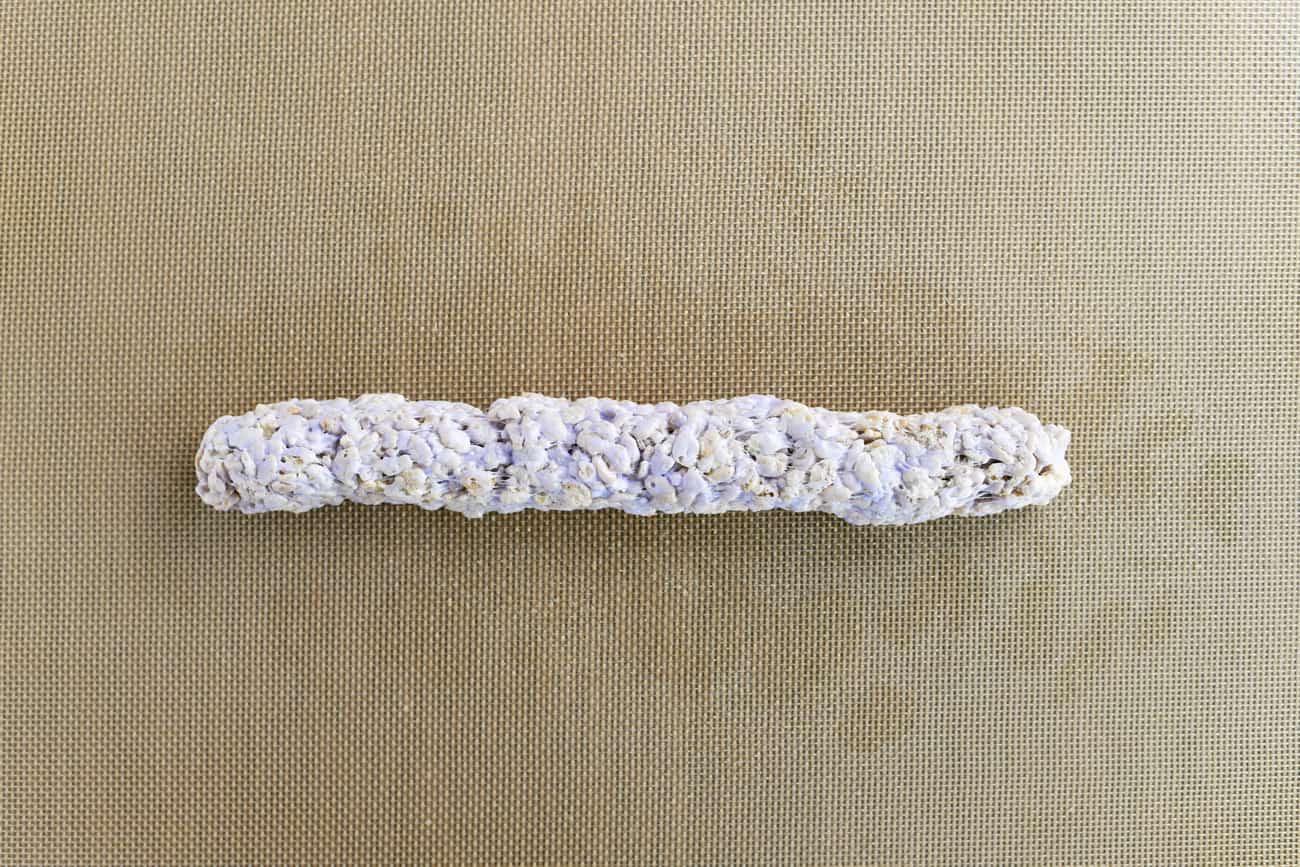 purple colored rice krispies rolled into a tube
