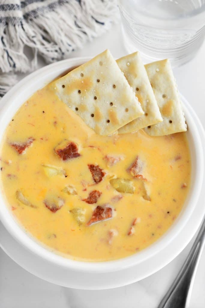 a bowl of soup with crackers in it