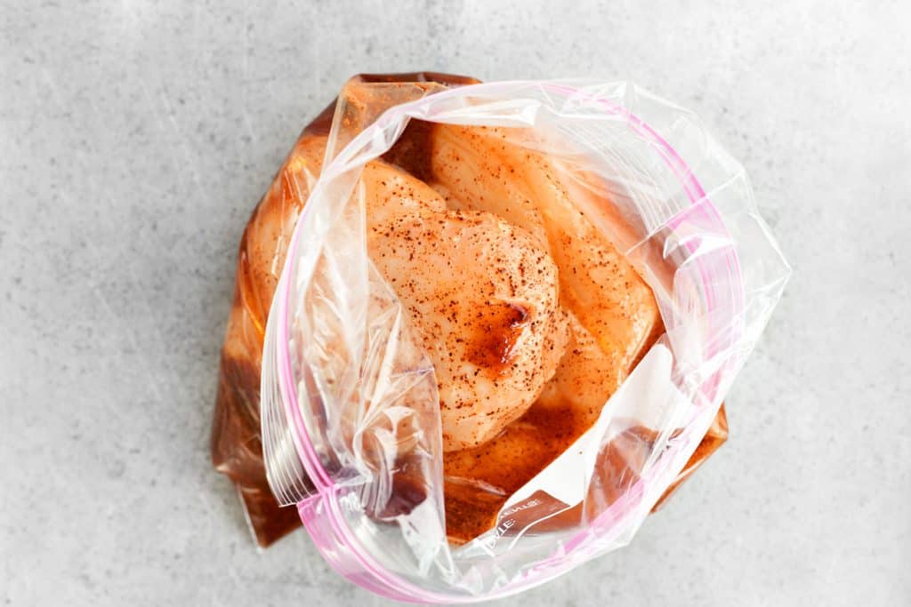 chicken breasts in ziptop bag with mango marinade