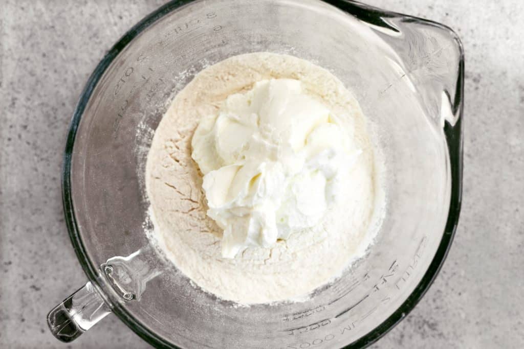 self rising flour and Greek yogurt in a bowl