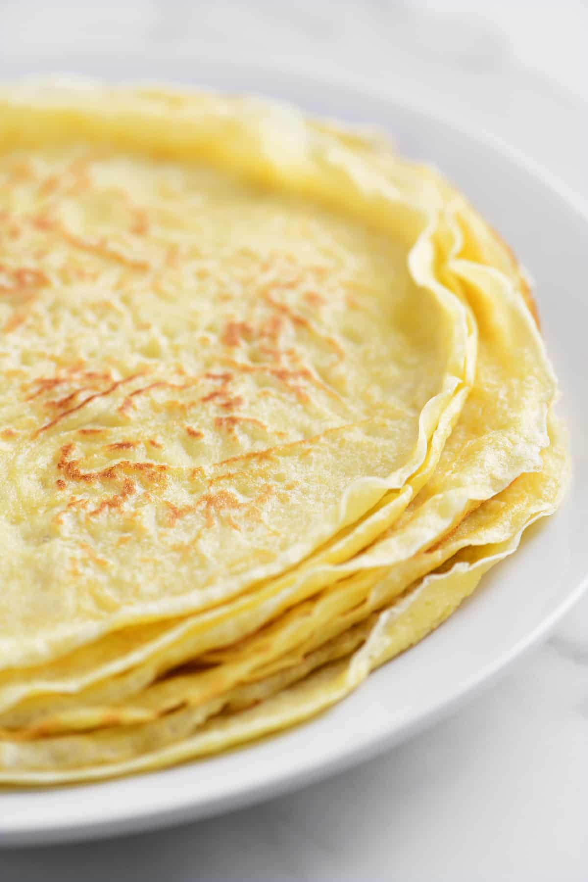 a stack of crepes on a plate