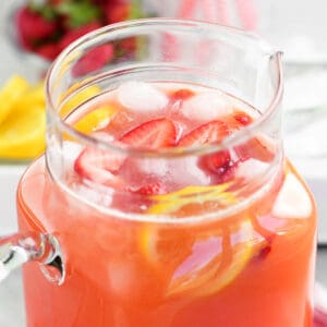 Strawberry lemonade in a pitcher.