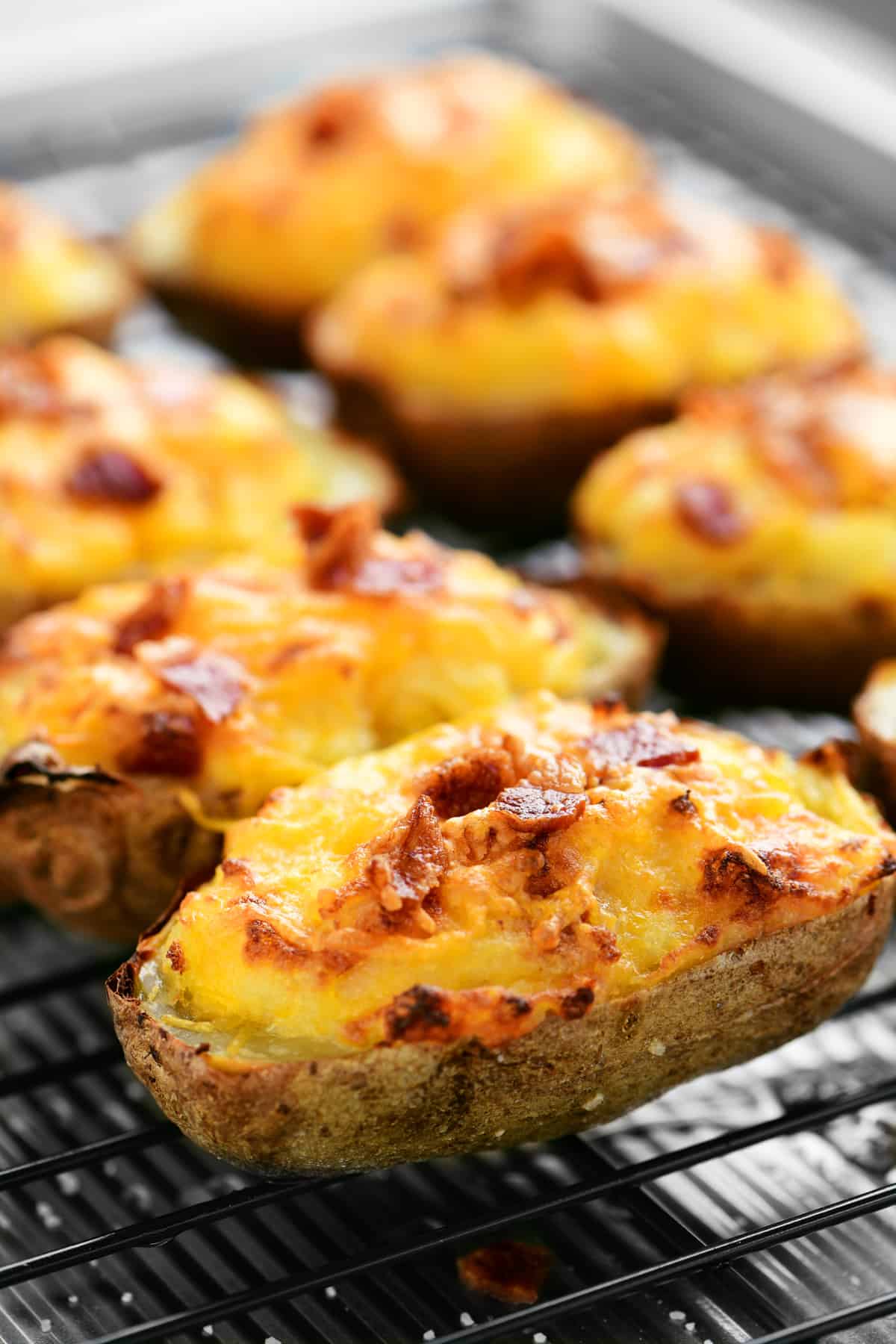 several twice baked potatoes on a wire rack