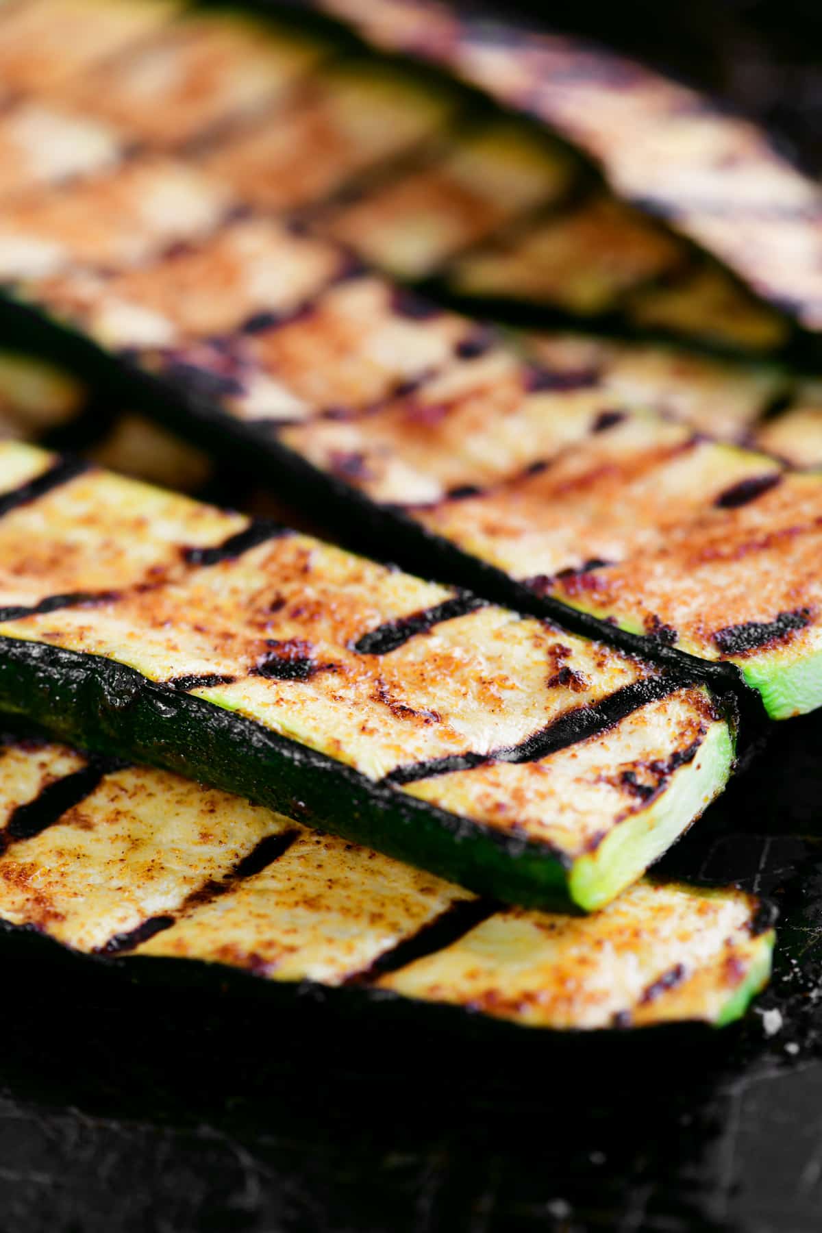 grilled zucchini slices in a pile