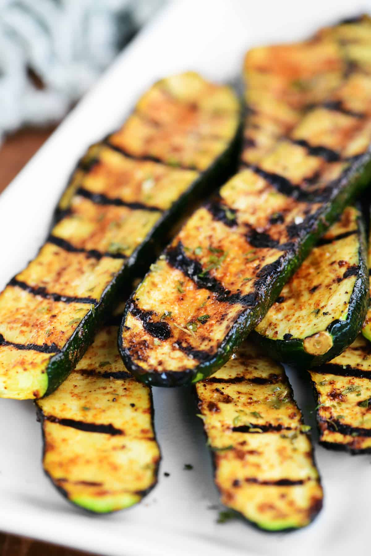 several pieces of grilled zucchini on a platter
