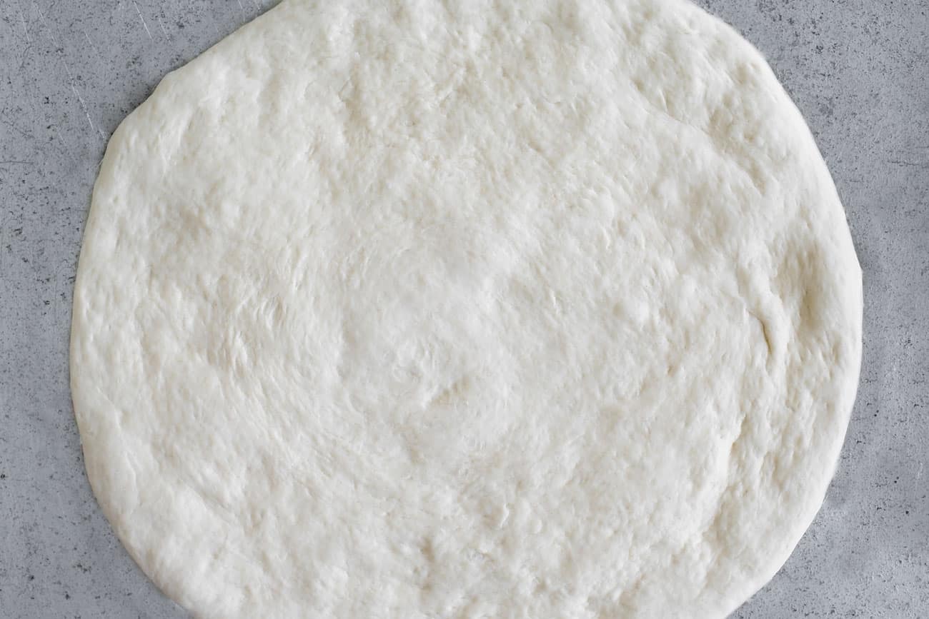 an unbaked pizza crust
