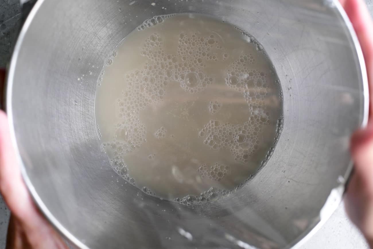 yeast and water in a metal bowl