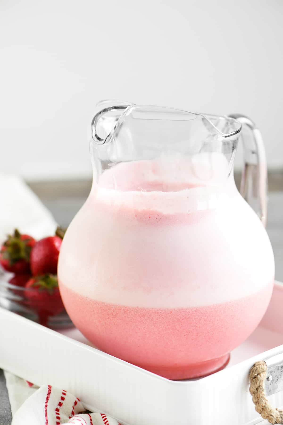 pitcher of a frothy pink beverage