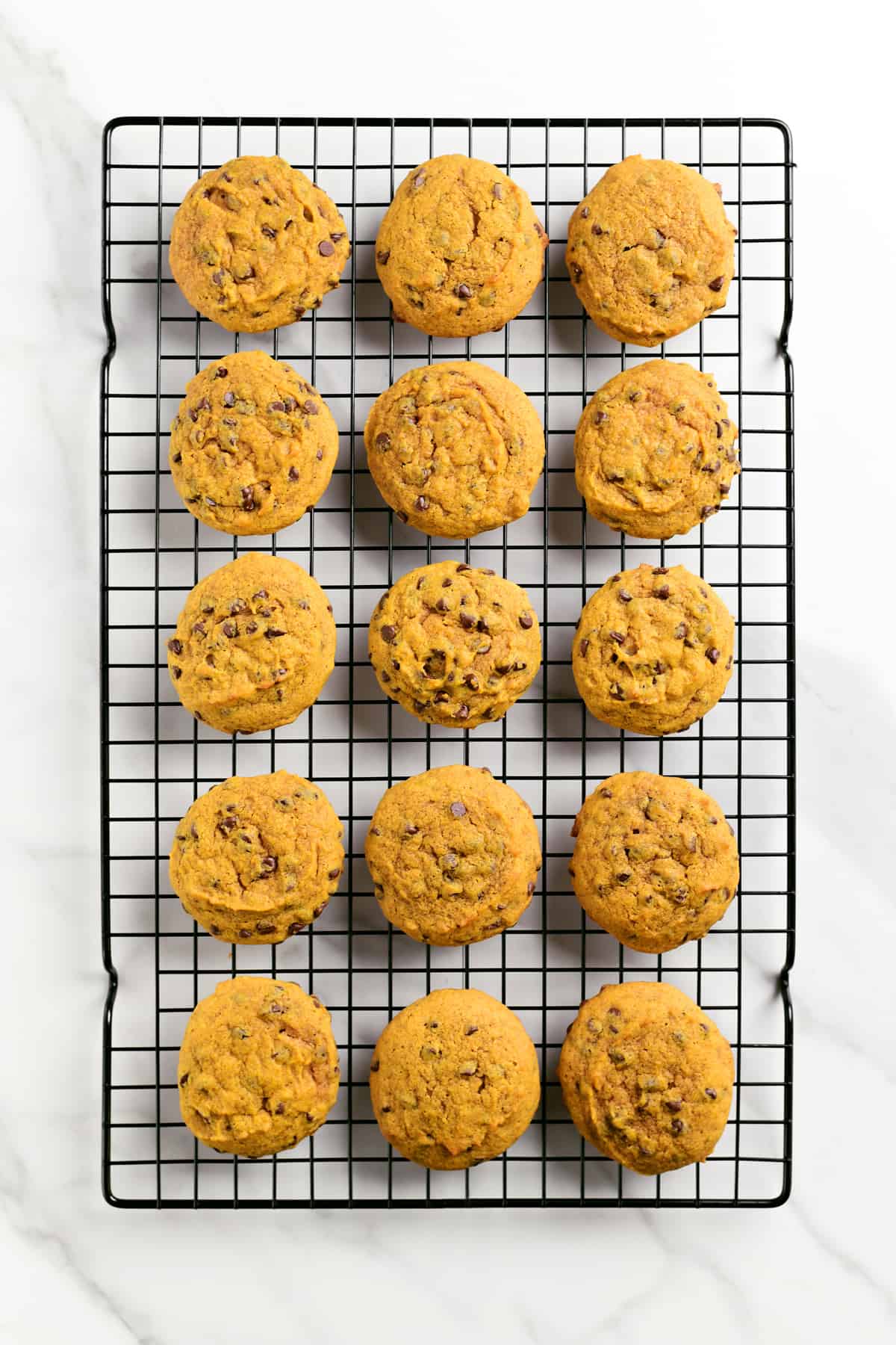 chocolate chip pumpkin cookies on a wire rack
