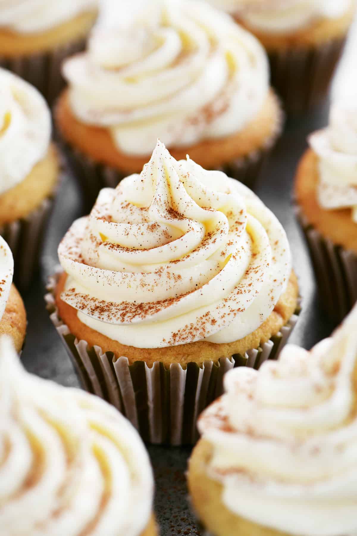 frosted cupcakes on a pan