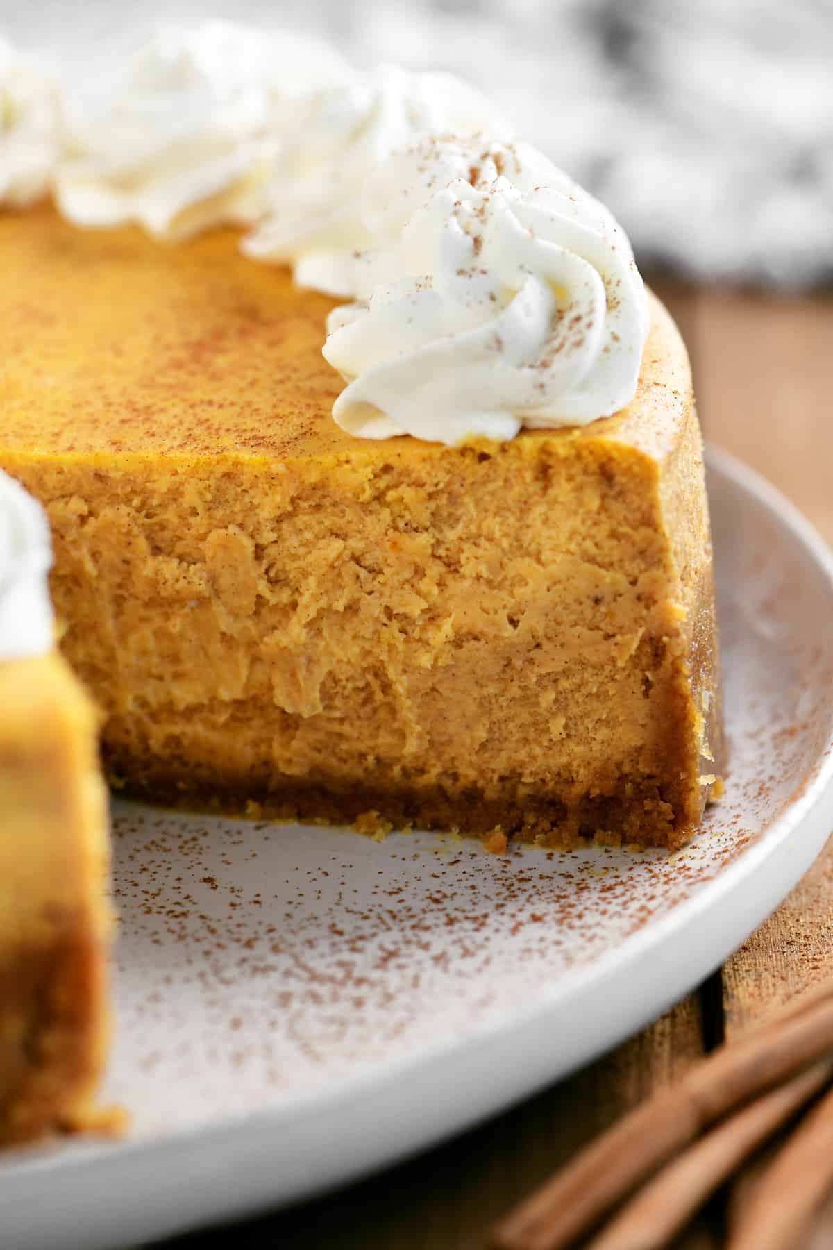 pumpkin cheesecake with a slice removed