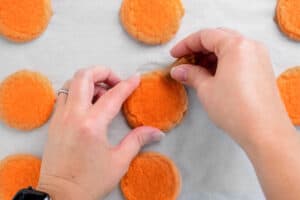 add a soft caramel to an orange sugar cookie for a stem