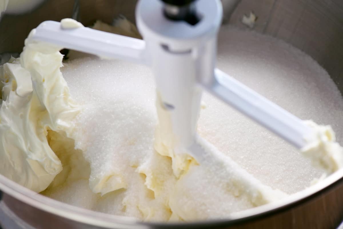add sugar to cream cheese in stand mixer