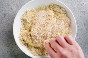 coat chicken with parmesan and breadcrumbs